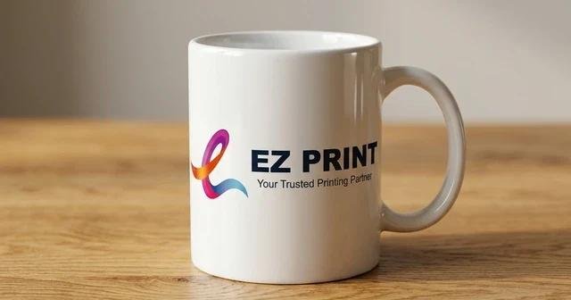 A ceramic promotional mug with printed corporate wrap branding.