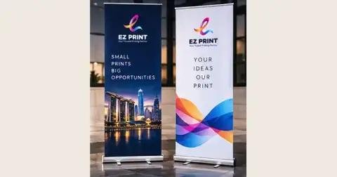 Illustrative pair of roll-up banner stands with printed display panels.