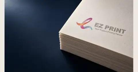 Illustrative close-up of textured white card with recessed lettering.