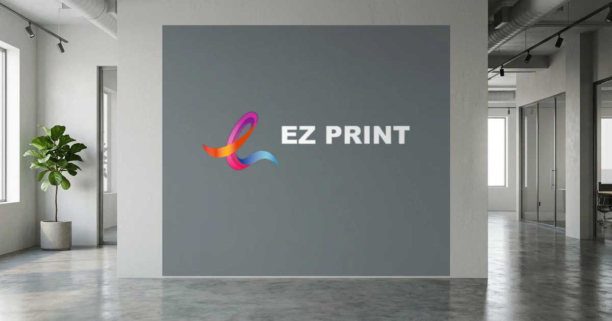 Large grey wall decal in an office printed with the EZ Print logo in white.