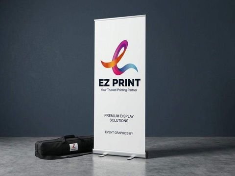 A premium freestanding roll-up banner stand with printed EZ Print display graphics beside a padded carrying case.