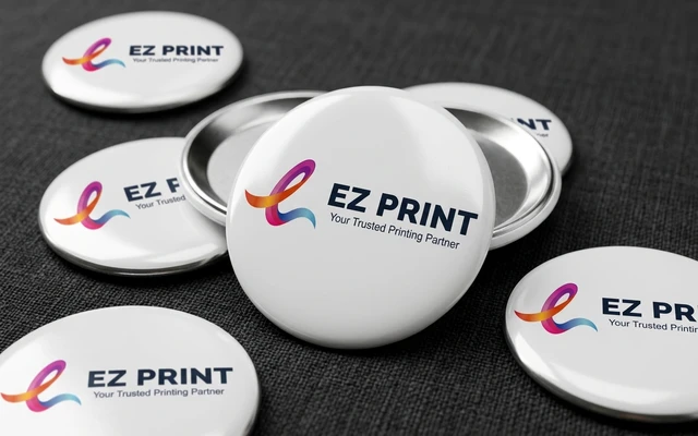 Pin button badges with glossy protective mylar film front, with the EZ Print logo.