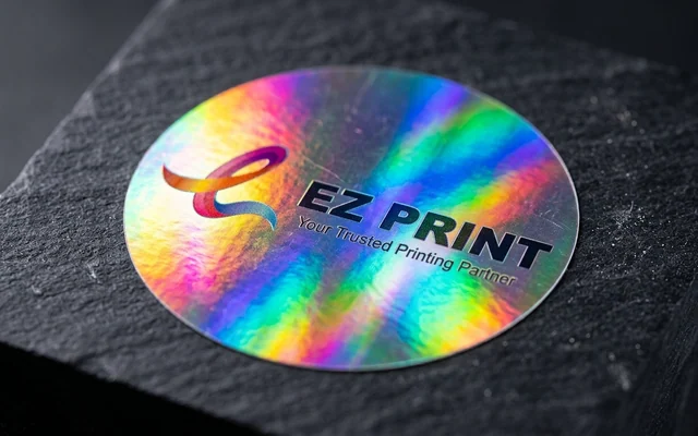 Security hologram stickers with iridescent rainbow optical reflection, with the EZ Print logo.