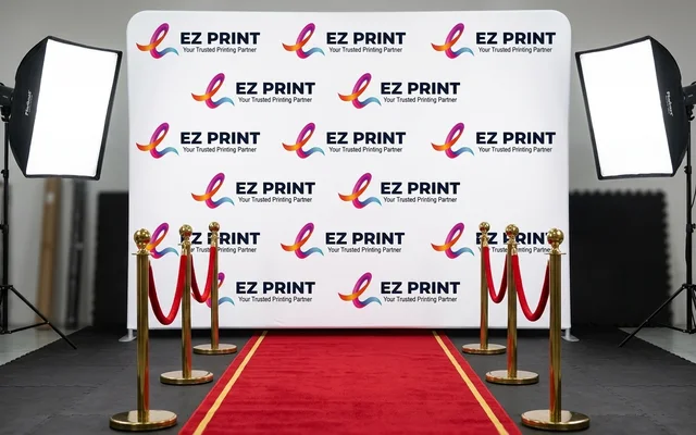 Straight media walls with step-and-repeat sponsor logo print, with the EZ Print logo.
